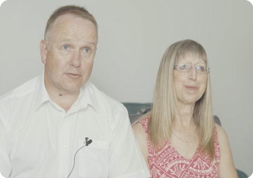 Screenshot of man and woman talking about pharmacy sale on video