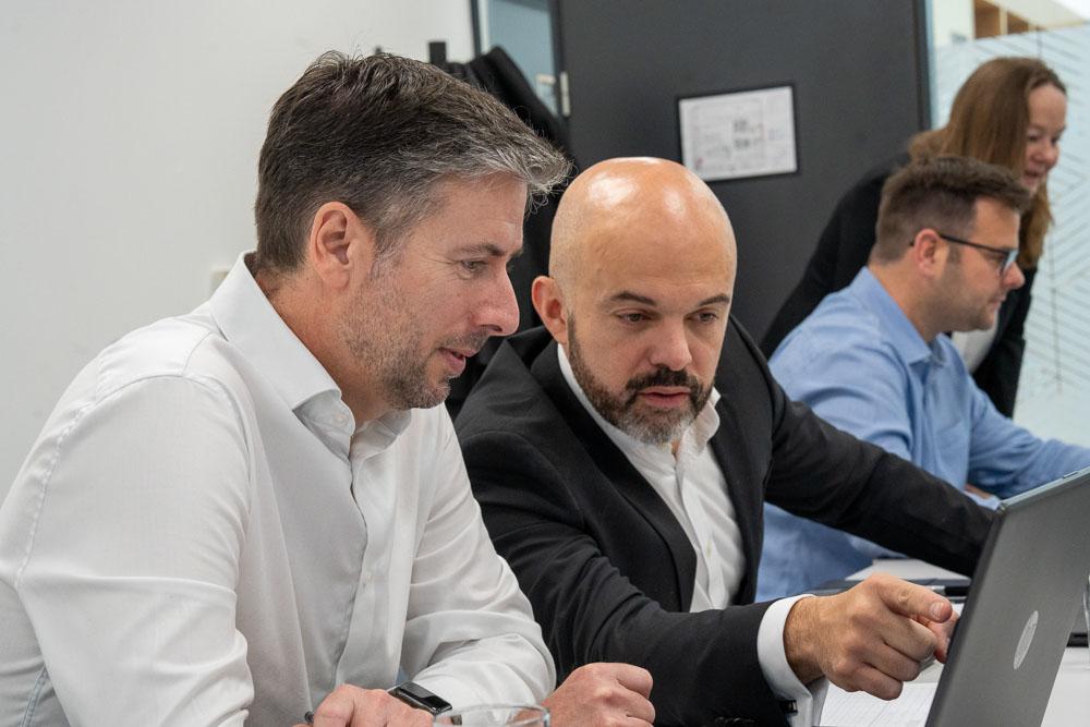 Paul and Matteo working at a laptop together